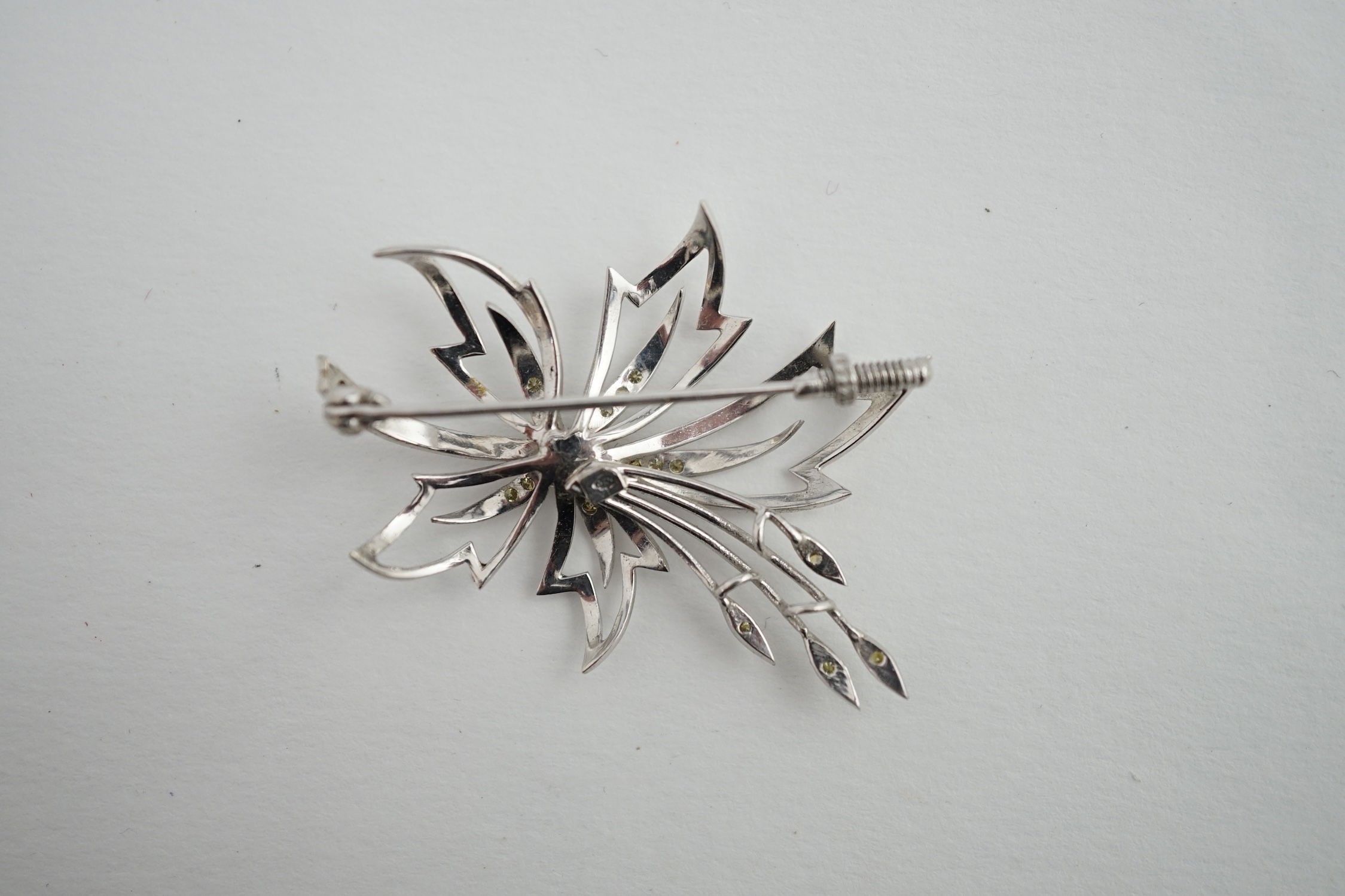 A modern 18k white gold and two colour diamond cluster set spray brooch